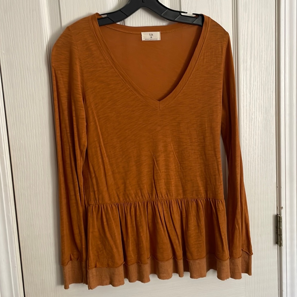 t.la burnt orange peplum top
